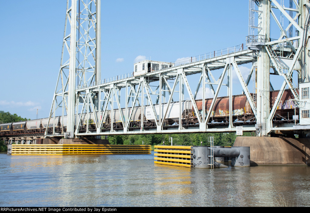 Closer shot of grain hoppers rolling across the Neches River Lift Bridge